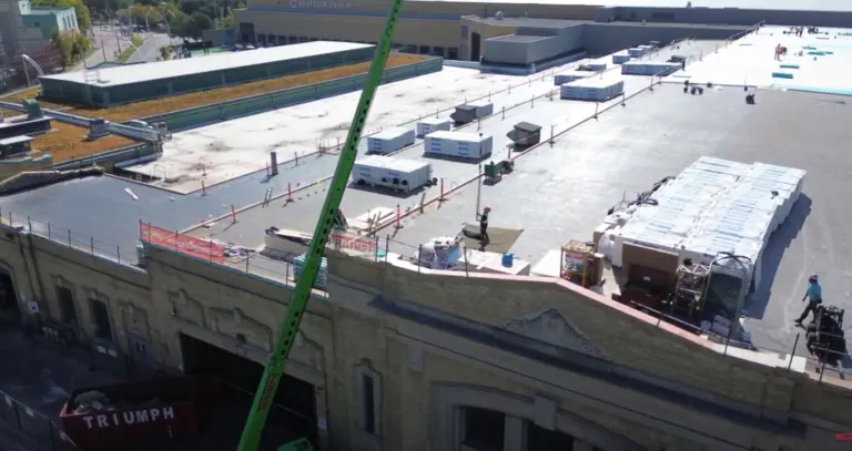 roof replacement, sheet metal works, sing ply roof system industry building project by Triumph Group of Companies