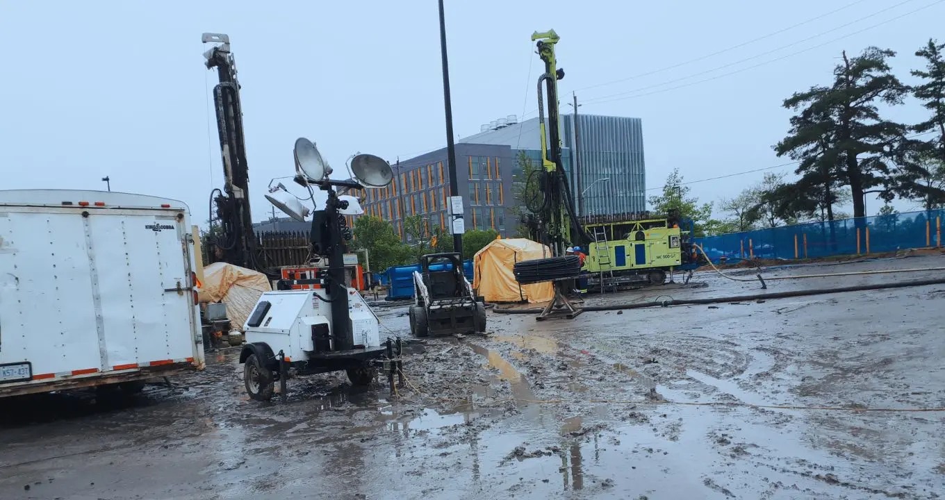Geothermal Project by Triumph Group of Companies. Energy team drilling the ground for the pipes and closed loop installation.