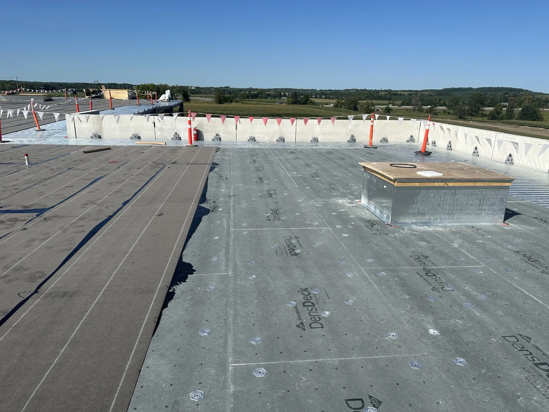 Vapour barrier material applied on an industrial roof by Triumph Group of Companies