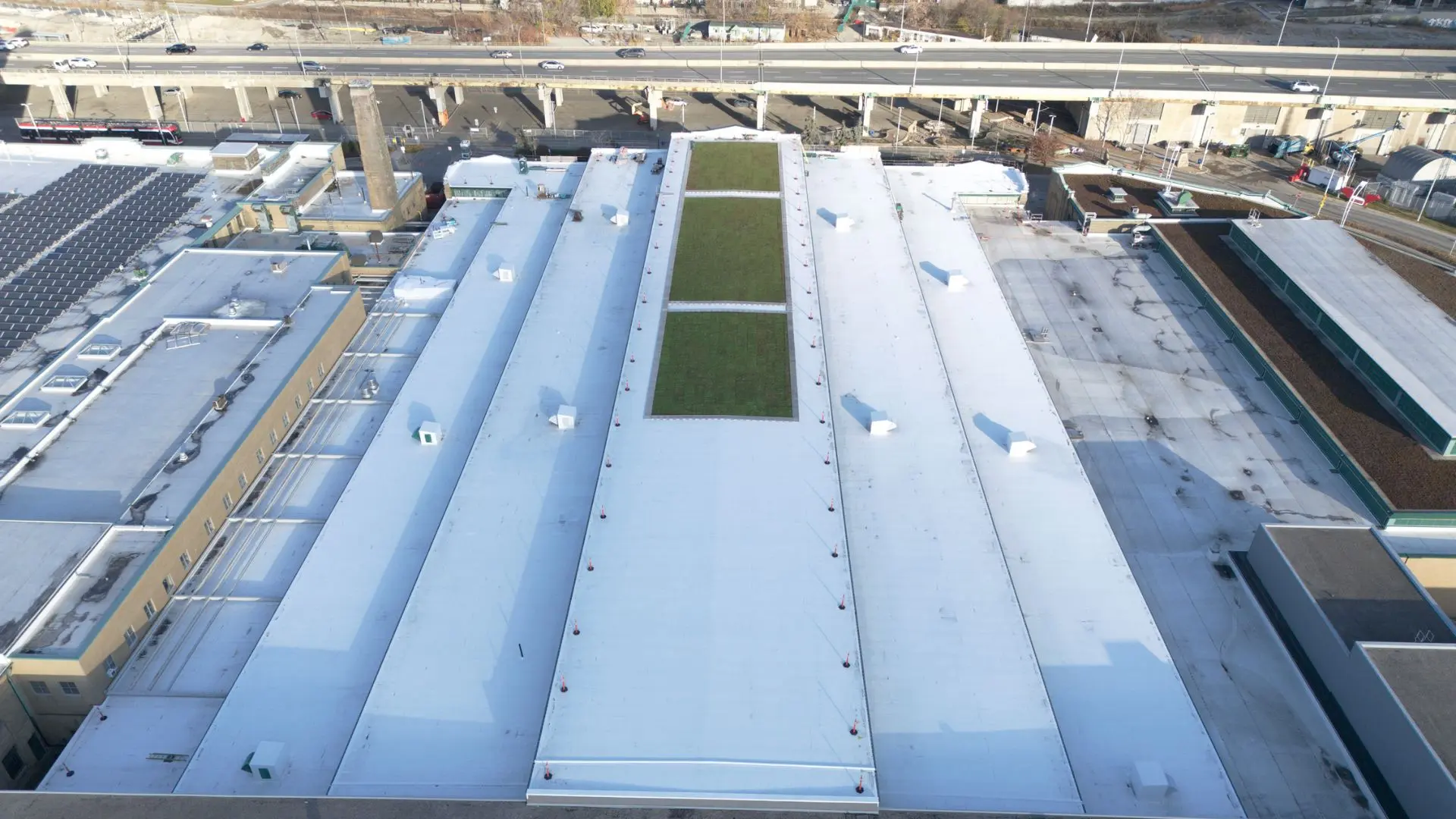 roof replacement, sheet metal works, sing ply roof system industry building project by Triumph Group of Companies